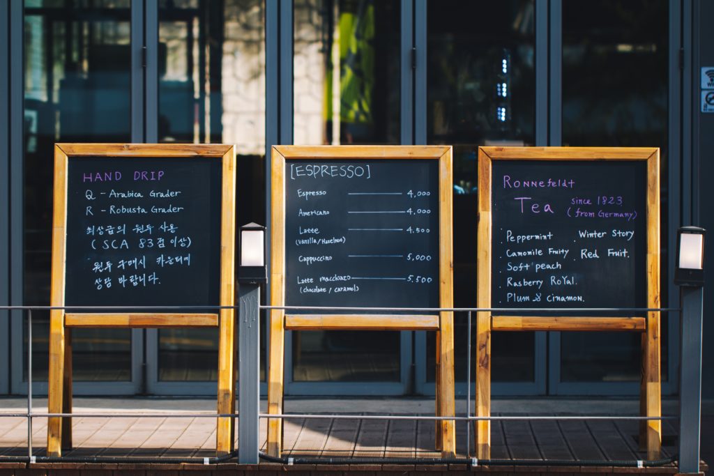 Image of sandwich board menus outside a restaurants